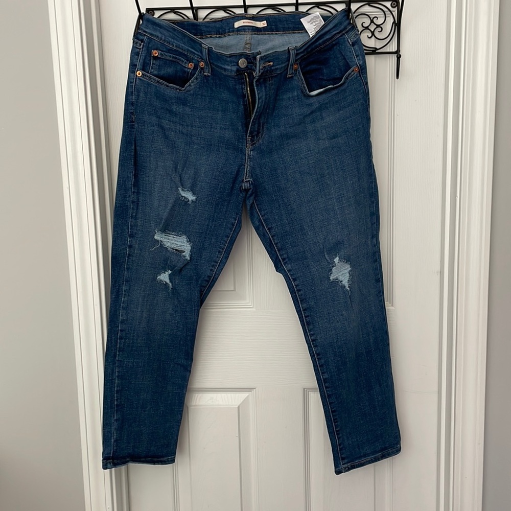 Levi jeans with some distress rips on the front.